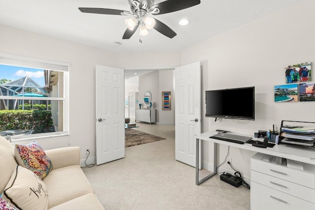 living area with baseboards, ceiling fan, recessed lighting, and light tile patterned floors