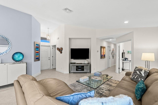 living room featuring baseboards, a chandelier, recessed lighting, and lofted ceiling