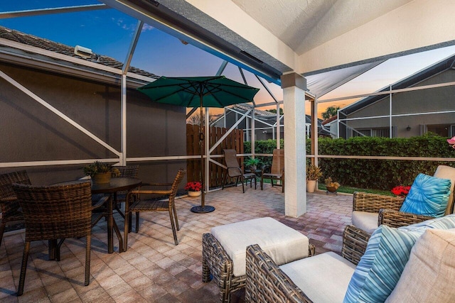 view of patio / terrace with a lanai and an outdoor living space