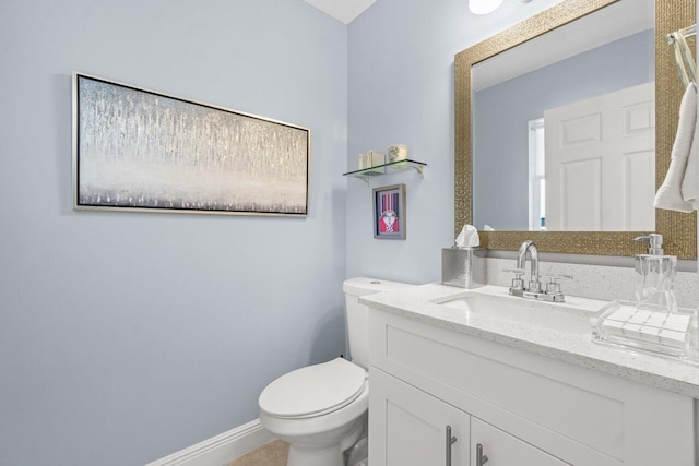 bathroom with toilet and vanity