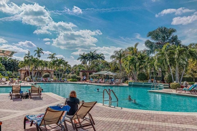 community pool featuring a patio area