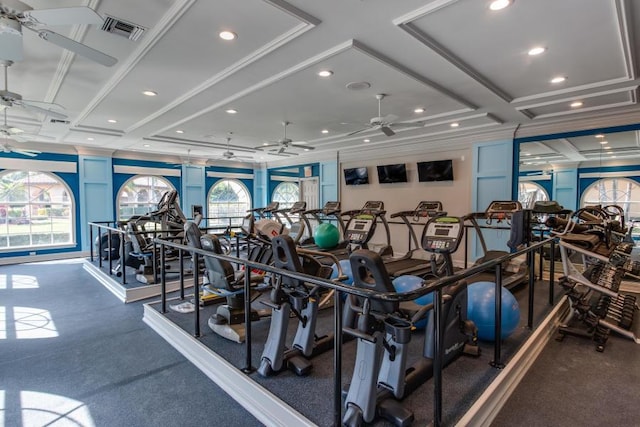workout area featuring ceiling fan, plenty of natural light, coffered ceiling, recessed lighting, and ornamental molding