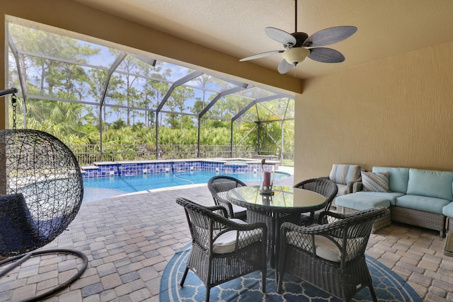 4885 SW Gossamer Cir, Palm City, FL 34990 - view of swimming pool with a patio area, a ceiling fan, a lanai, a pool with connected hot tub, and outdoor dining space