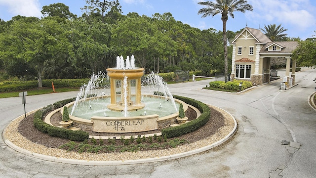 4885 SW Gossamer Cir, Palm City, FL 34990 - view of community featuring curved driveway