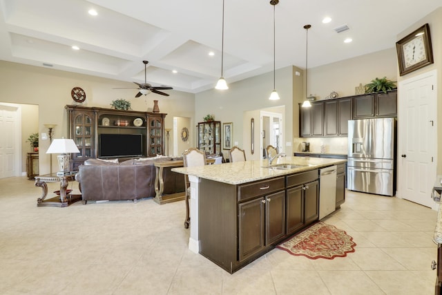 4885 SW Gossamer Cir, Palm City, FL 34990 - kitchen featuring stainless steel appliances, a sink, coffered ceiling, ceiling fan, and dark brown cabinetry