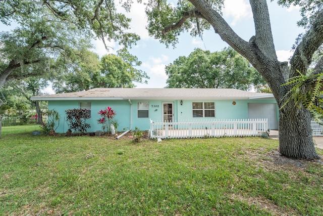 7302 Banyan St, Fort Pierce, FL 34951 - ranch-style house featuring an attached garage and stucco siding