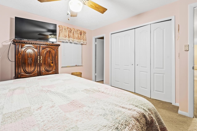 7302 Banyan St, Fort Pierce, FL 34951 - bedroom featuring light carpet, a closet, a ceiling fan, and baseboards