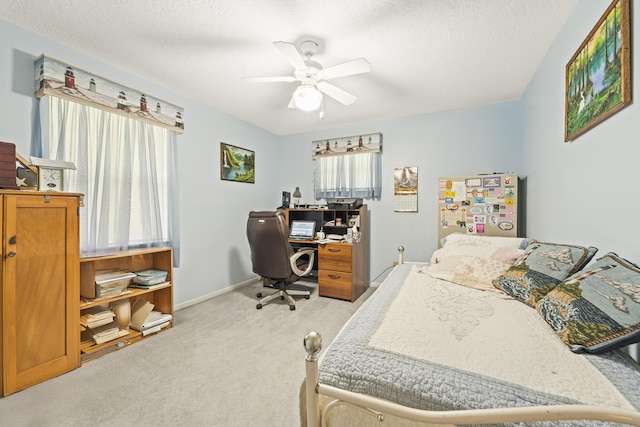 7302 Banyan St, Fort Pierce, FL 34951 - carpeted bedroom with a desk, a ceiling fan, baseboards, and a textured ceiling