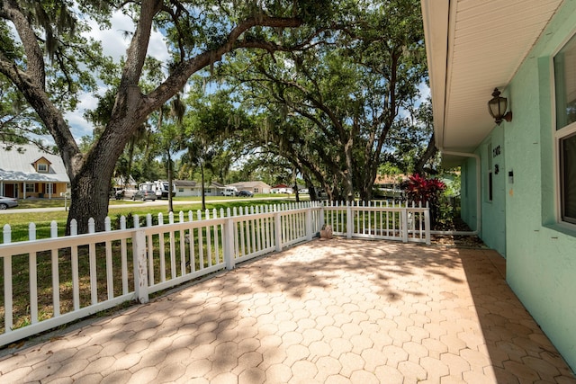 7302 Banyan St, Fort Pierce, FL 34951 - view of patio / terrace featuring a residential view and fence