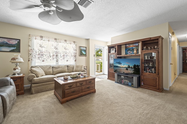 7302 Banyan St, Fort Pierce, FL 34951 - living area with ceiling fan, light colored carpet, and a textured ceiling