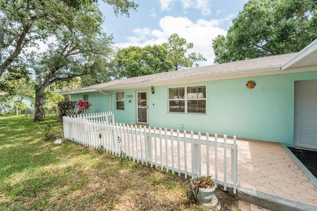 7302 Banyan St, Fort Pierce, FL 34951 - ranch-style house with stucco siding and a shingled roof