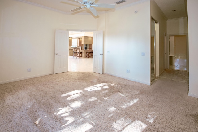 unfurnished bedroom with carpet flooring, ornamental molding, and baseboards
