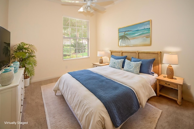 bedroom with carpet, baseboards, and a ceiling fan