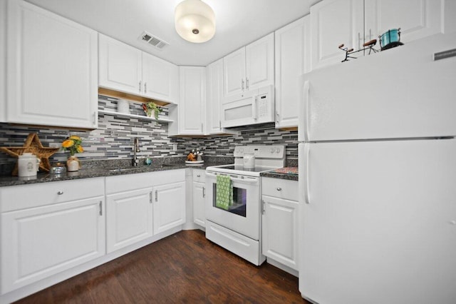 2600 SE Ocean Blvd Unit Jj-6, Stuart, FL 34996 - kitchen featuring white appliances, a sink, white cabinetry, and decorative backsplash