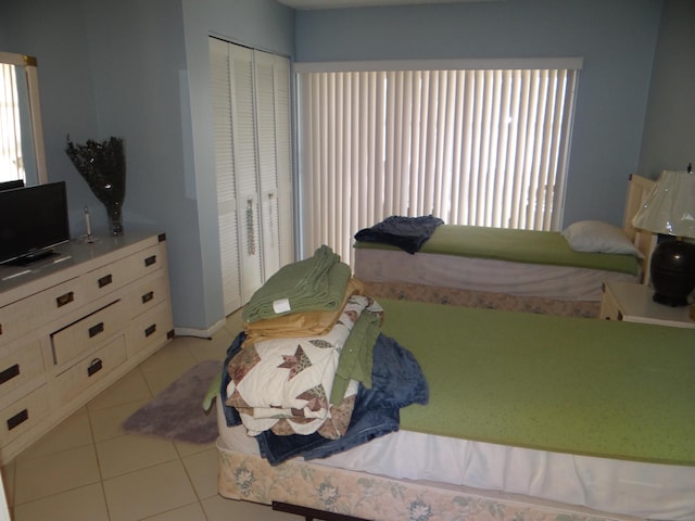 12005 Poinciana Blvd Unit 103, Royal Palm Beach, FL 33411 - tiled bedroom with multiple windows and a closet