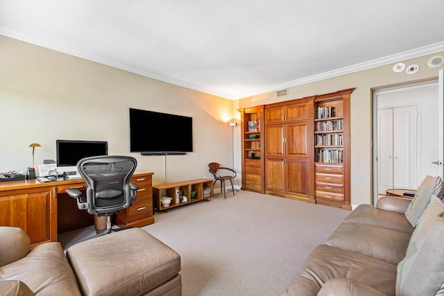 carpeted living area featuring ornamental molding and a desk