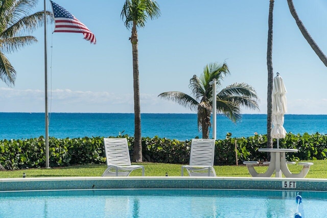 community pool featuring a water view