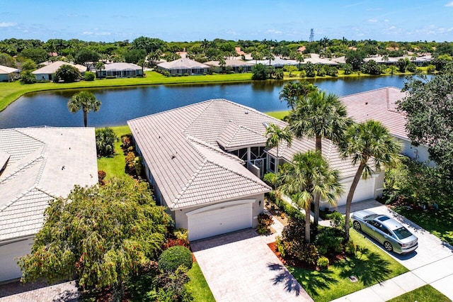 aerial view of residential area featuring a nearby body of water