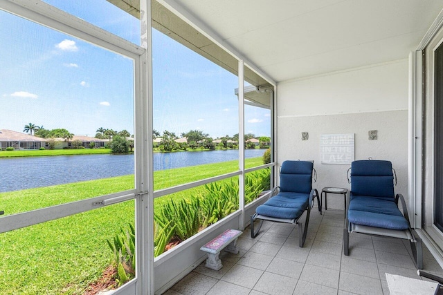 sunroom / solarium with a water view