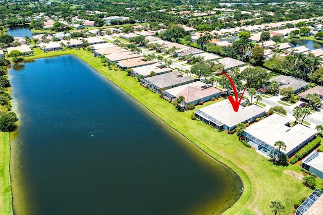 aerial perspective of suburban area featuring a nearby body of water