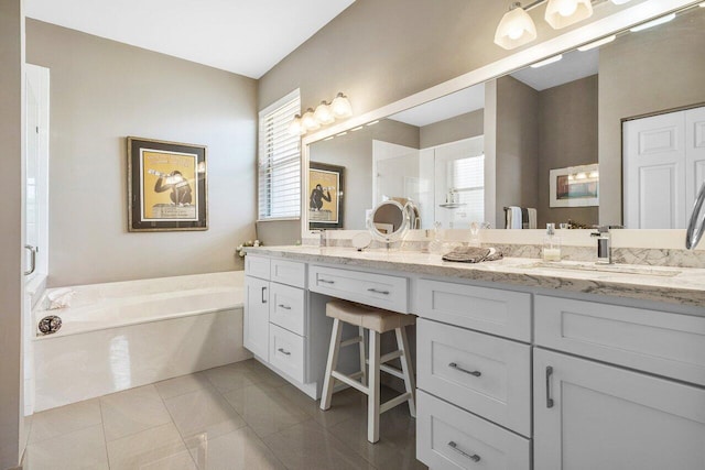 full bath with a garden tub, double vanity, tile patterned floors, and a shower