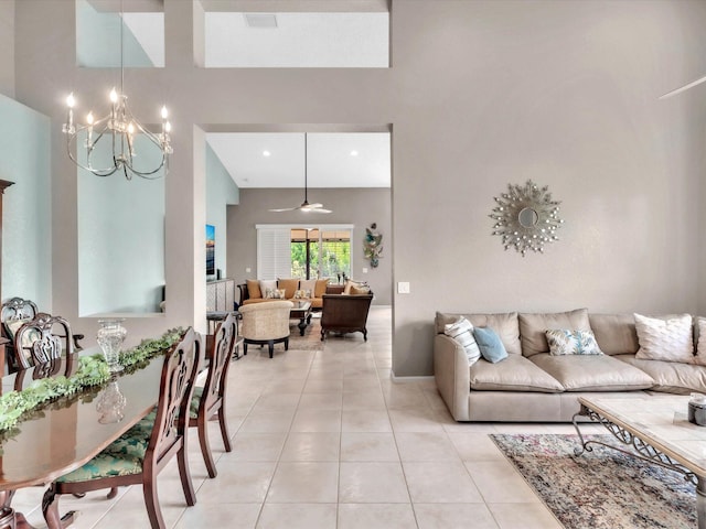 living room featuring a chandelier, light tile patterned floors, and ceiling fan