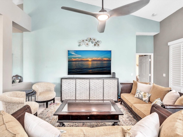 living area with lofted ceiling and a ceiling fan