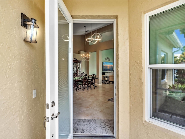 property entrance with stucco siding
