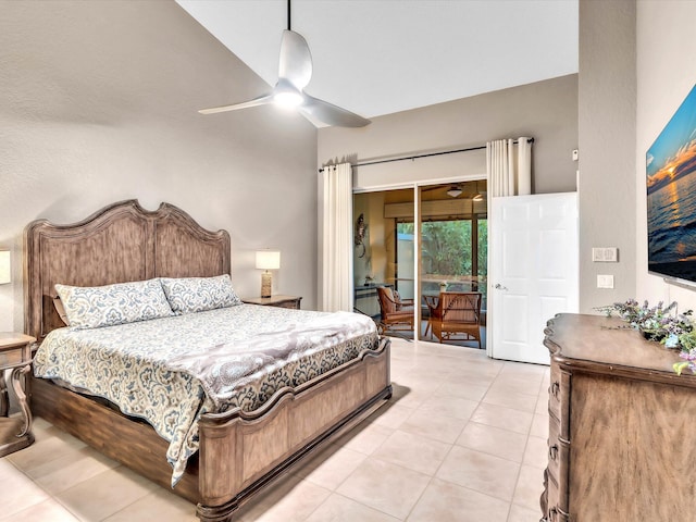 bedroom featuring access to outside, light tile patterned floors, and a ceiling fan