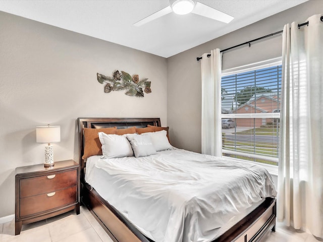 bedroom with light tile patterned floors and a ceiling fan