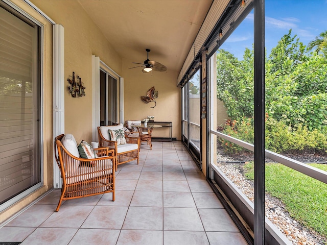sunroom / solarium featuring ceiling fan and vaulted ceiling