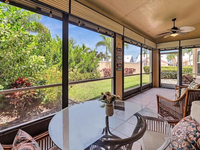 sunroom / solarium with ceiling fan