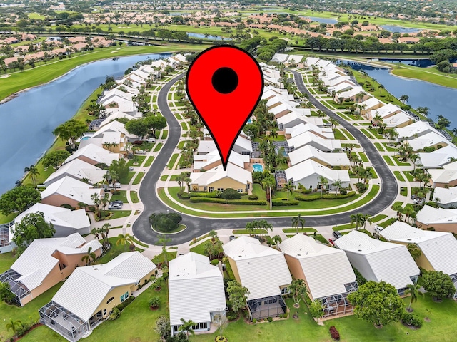 aerial perspective of suburban area with a nearby body of water