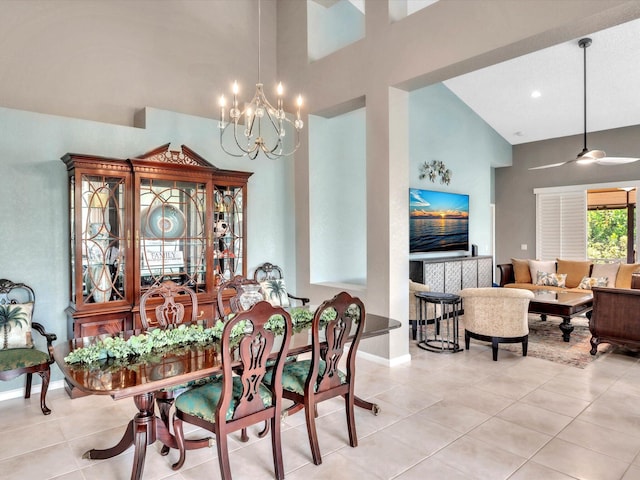tiled dining area featuring high vaulted ceiling, a chandelier, and baseboards