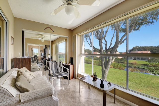 5876 Regal Glen Dr Unit 209, Boynton Beach, FL 33437 - sunroom / solarium featuring a ceiling fan, a water view, and tile patterned floors