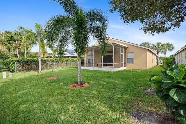 8998 SW Bonneville Dr, Stuart, FL 34997 - view of yard with a sunroom