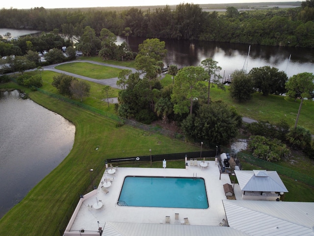 8998 SW Bonneville Dr, Stuart, FL 34997 - aerial view of a nearby body of water, a pool, and a forest