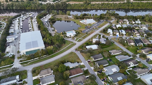 8998 SW Bonneville Dr, Stuart, FL 34997 - aerial overview of property's location featuring a large body of water and nearby suburban area