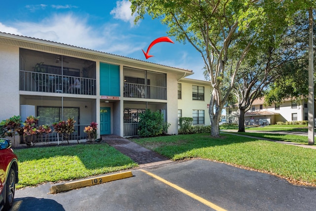 9930 Pineapple Tree Dr Unit 202, Boynton Beach, FL 33436 - view of building exterior with uncovered parking