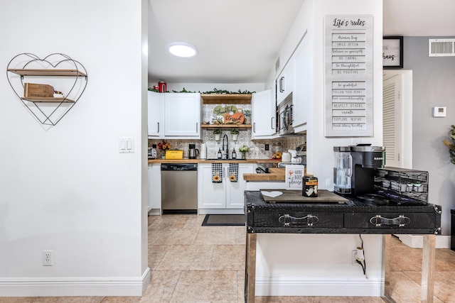 9930 Pineapple Tree Dr Unit 202, Boynton Beach, FL 33436 - kitchen featuring stainless steel appliances, open shelves, white cabinets, decorative backsplash, and a sink