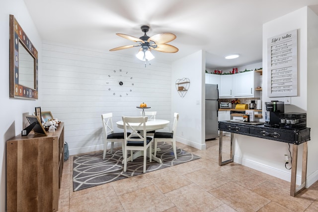 9930 Pineapple Tree Dr Unit 202, Boynton Beach, FL 33436 - dining area with a ceiling fan, baseboards, and wooden walls