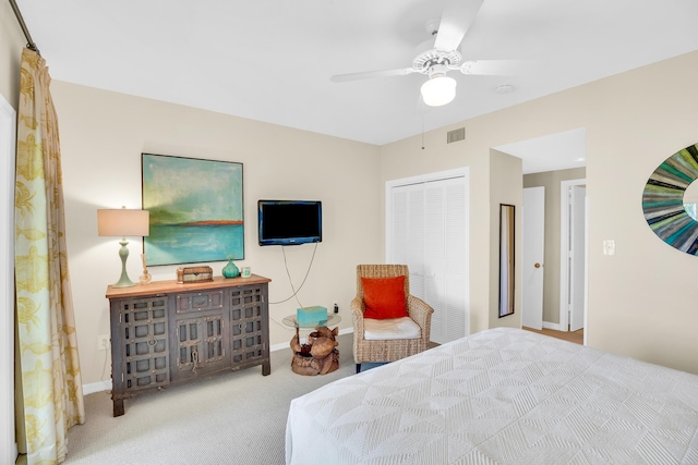 bedroom featuring baseboards, a closet, ceiling fan, and carpet flooring