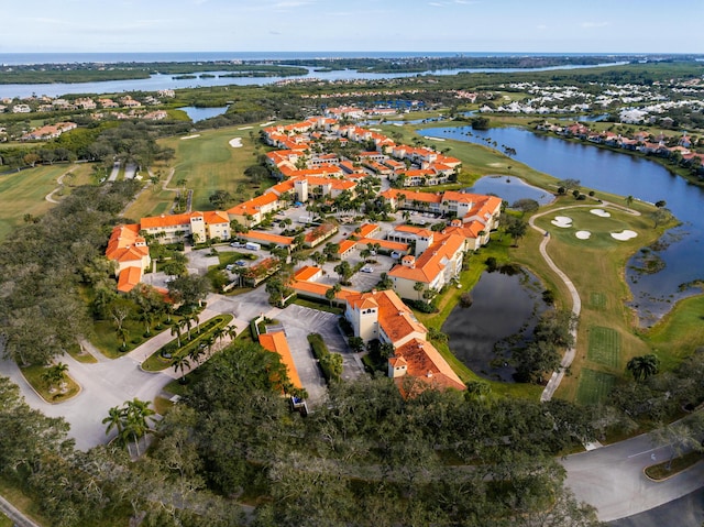 aerial overview of property's location featuring a large body of water, a golf club, and nearby suburban area