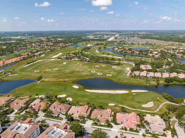 aerial overview of property's location with nearby suburban area, a nearby body of water, and a local golf course