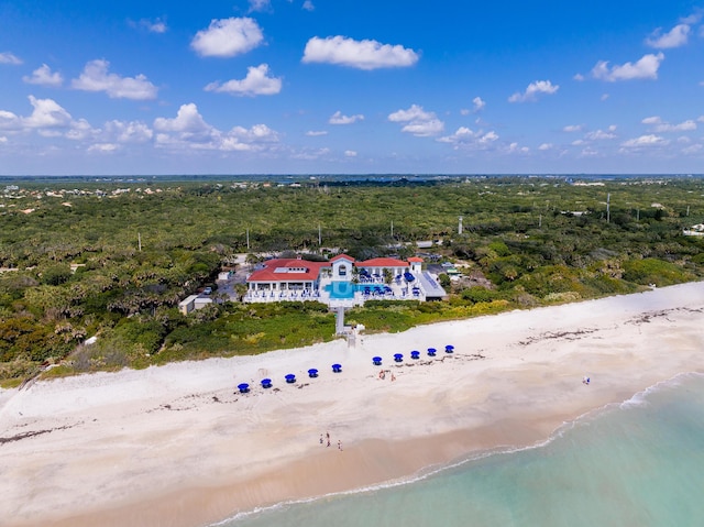 aerial view of extended coastline and a heavily wooded area