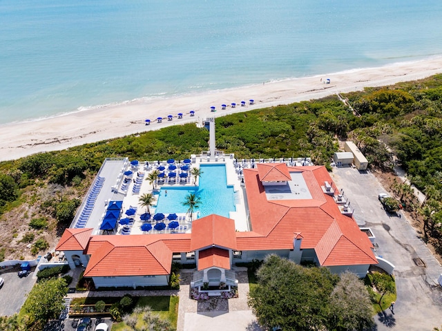 drone / aerial view of unending shoreline and a pool