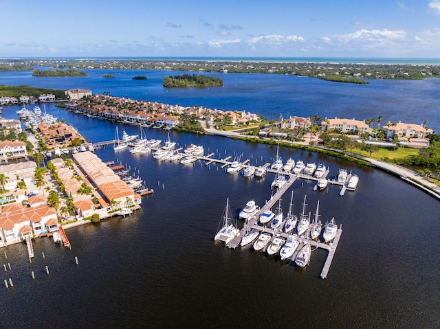 aerial view of numerous boat docks and a nearby body of water