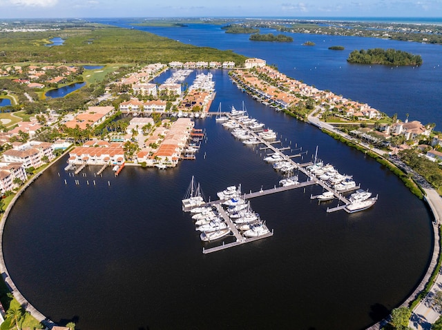 drone / aerial view of a large body of water and a marina
