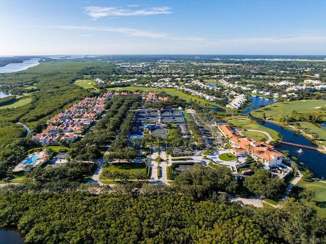 aerial overview of property's location featuring a large body of water and nearby suburban area