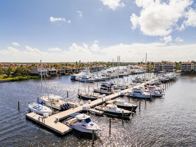 dock area featuring view of marina and a water view